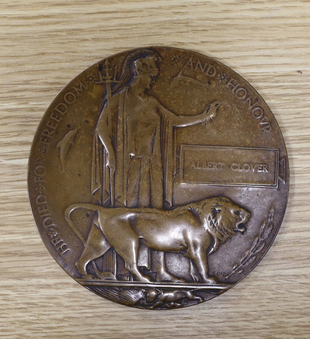 A framed World War One memorial to Pte. G J Foster, London Regiment, and a Memorial plaque to Albert Clover